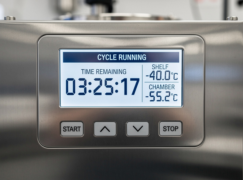 A freeze dryer control panel showing a running cycle with time and temperature